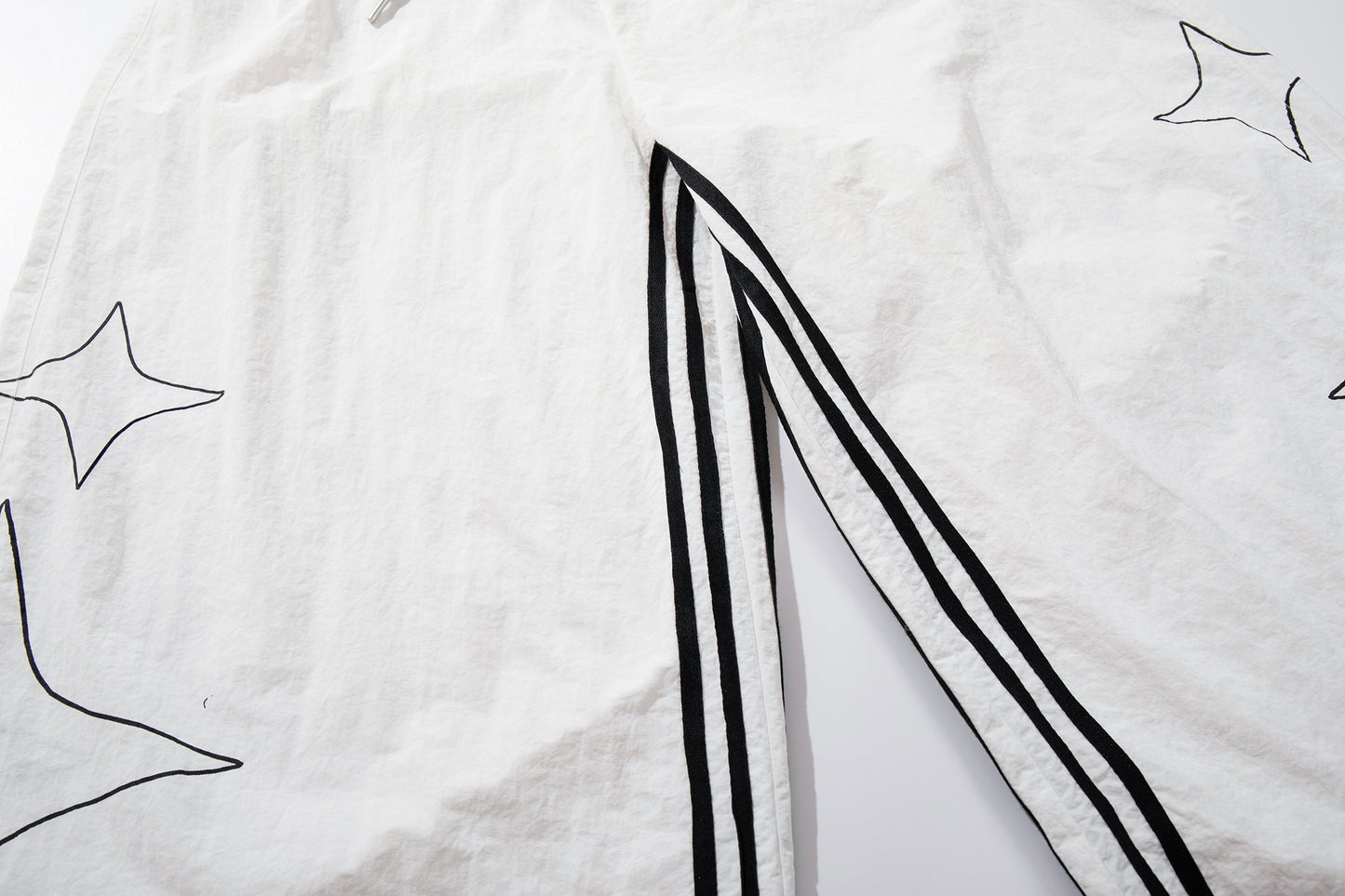CapCabin “Starline Wide-Leg Track Pants”