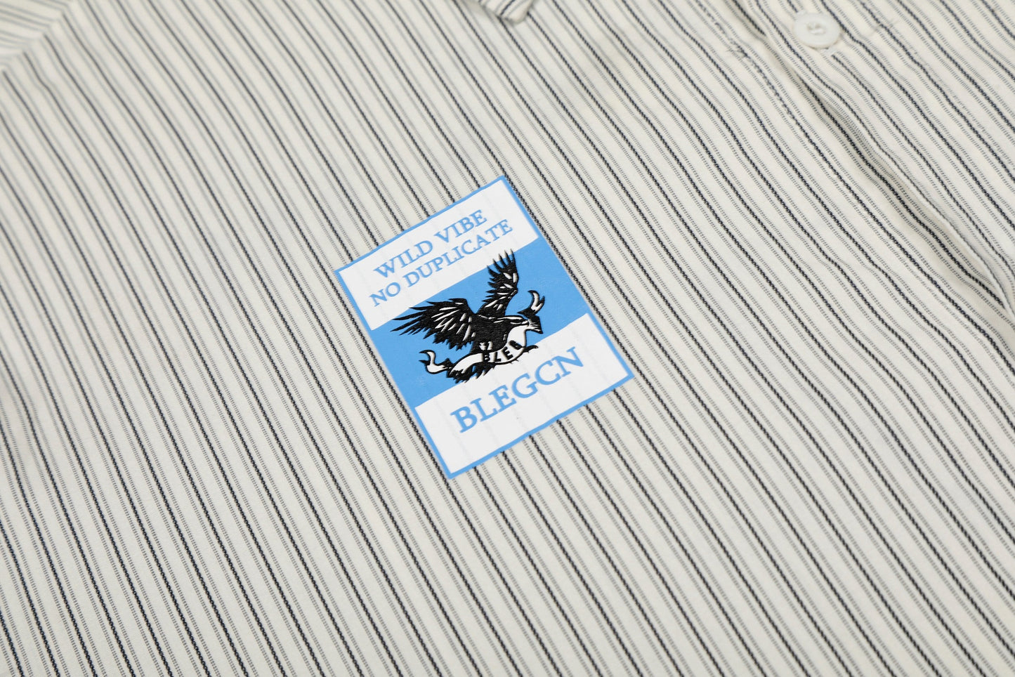 CapCabin “Pinstripe Patch Graphic Shirt”