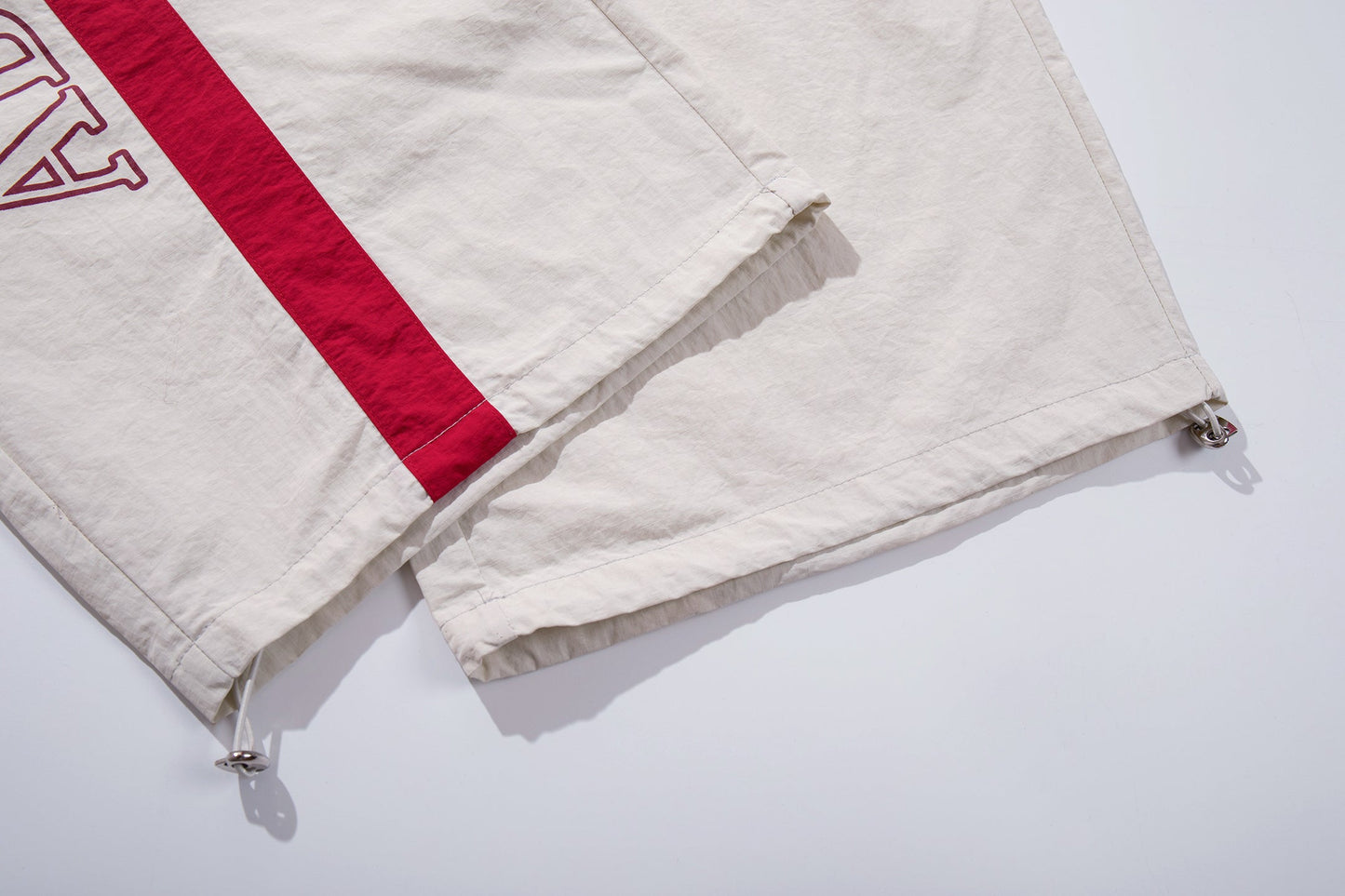 CapCabin Cross Graphic Wide-Leg Track Pants