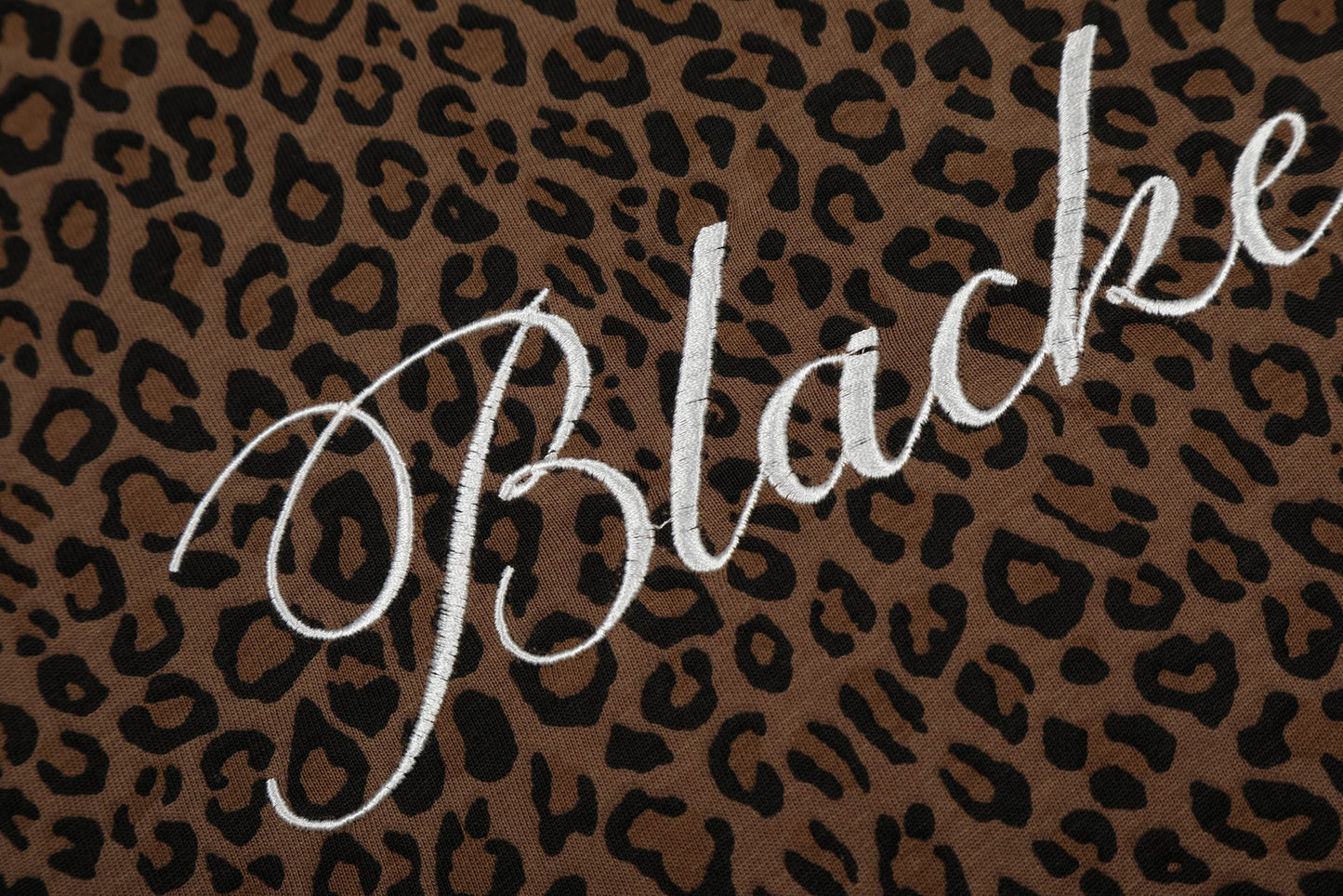 CapCabin “Leopard Script Polo Tee”